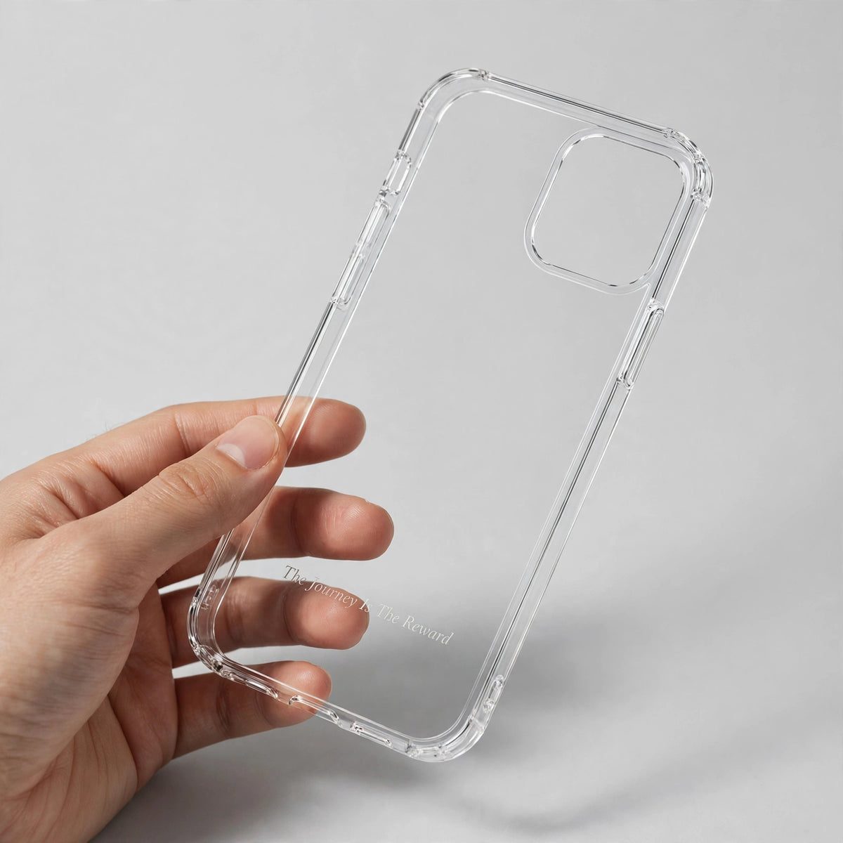 Grateful Clear Phone Case held in hand showing engraved text